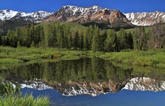 The Boulder Mountains reflect in Silver Creek